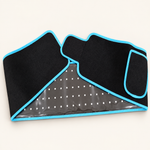 ZURAÉ black red light belt with blue edging, on an ivory studio background.